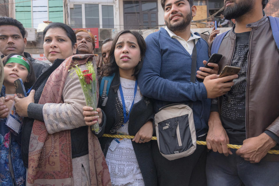 A girl tries to break from the crowd to present a bouquet of flowers to Rahul Gandhi in New Delhi, India, on Dec. 24, 2022.<span class="copyright">Ronny Sen for TIME</span>