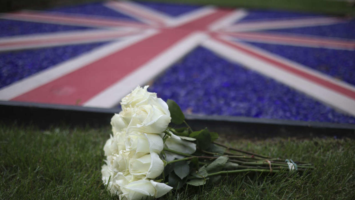 WASHINGTON, DC - SEPTEMBER 08: Flowers are laid outside the British Embassy after the death of Queen Elizabeth II was announced on September 8, 2022 in Washington, DC. Elizabeth Alexandra Mary Windsor was born in Bruton Street, Mayfair, London on 21 April 1926. She married Prince Philip in 1947 and acceded the throne of the United Kingdom and Commonwealth on 6 February 1952 after the death of her Father, King George VI.Queen Elizabeth II died at Balmoral Castle in Scotland on September 8, 2022, and is survived by her four children, Charles, Prince of Wales, Anne, Princess Royal, Andrew, Duke Of York and Edward, Duke of Wessex.    Win McNamee/Getty Images/AFP (Photo by WIN MCNAMEE / GETTY IMAGES NORTH AMERICA / Getty Images via AFP)