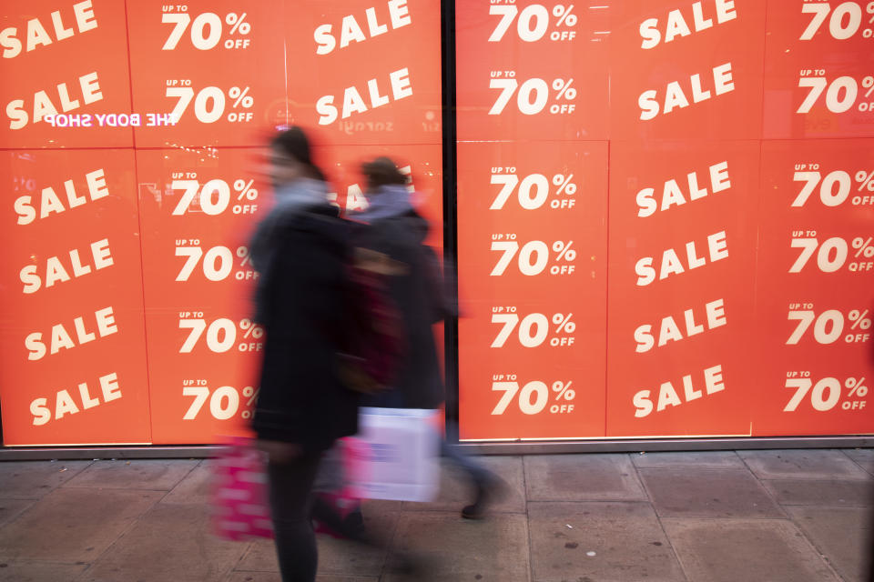 People out shopping on Oxford Street walk past large scale January sale signs in red and white for major high street clothing retail shops on 7th January 2019 in London, United Kingdom. Its time for the Winter sales, and most shops are advertising big reductions in prices. Bargains are available and the shopping streets are busy. Oxford Street is a major road in the West End of London. It is Europe's busiest shopping street, with around half a million daily visitors, and has approximately 300 shops. (photo by Mike Kemp/In Pictures via Getty Images Images)