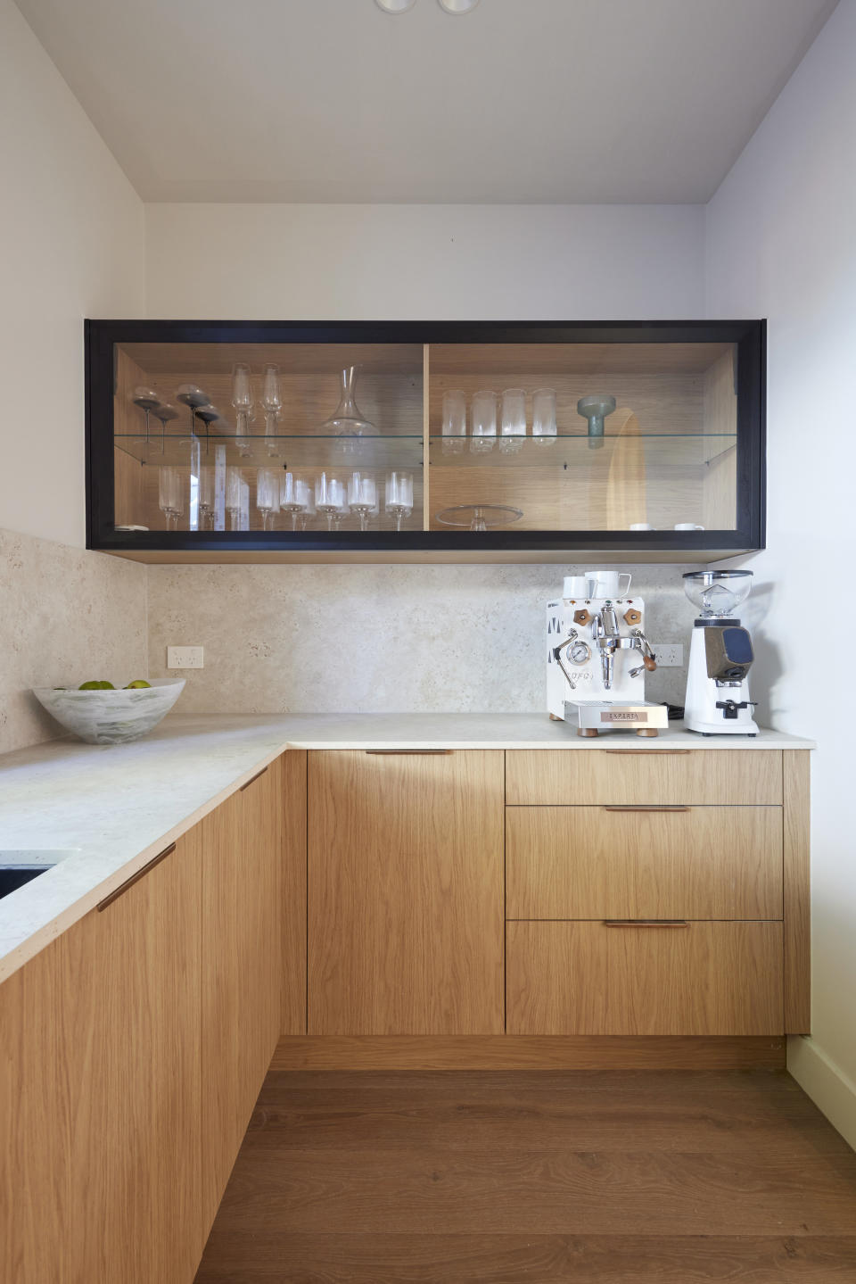 Light wooden draws and cupboard with shelf space above. 