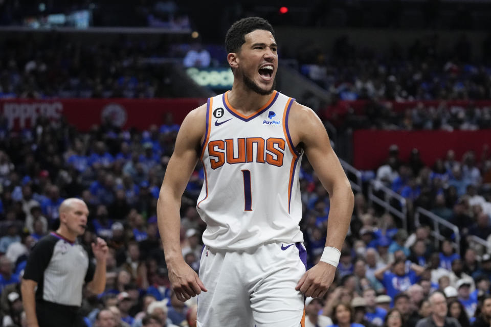 Phoenix Suns guard Devin Booker reacts after scoring during Game 3 of a first-round NBA playoff series against the Los Angeles Clippers on April 20, 2023 in Los Angeles. (AP Photo/Ashley Landis)