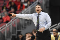 Georgia Tech head coach Josh Pastner signals to his team during the first half of an NCAA college basketball game against Louisville in Louisville, Ky., Wednesday, Feb. 1, 2023. (AP Photo/Timothy D. Easley)