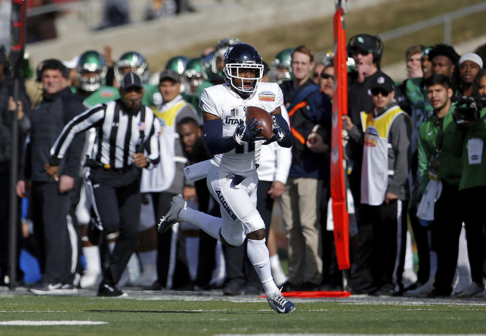 Utah State wide receiver Aaren Vaughns catches a pass before scoring a touchdown against North Texas during the first half of the New Mexico Bowl NCAA college football game in Albuquerque, N.M., Saturday, Dec. 15, 2018. (AP Photo/Andres Leighton)