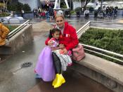 Andrea Vizcarra and her 4-year-old daughter Maria Jose here on a family vacation from Mexico but their plans were upended when Disney and Universal closed, at Disneyland in Anaheim, Calif. on Friday, March 13, 2020. They were going to see their two-day trip cut short and raced over to the park late Thursday to try to maximize their time there. Disneyland is closing its doors for the rest of the month, shuttering one of California's best-known attractions as the state hurries to stop the spread of the coronavirus. (AP Photo/Amy Taxin)