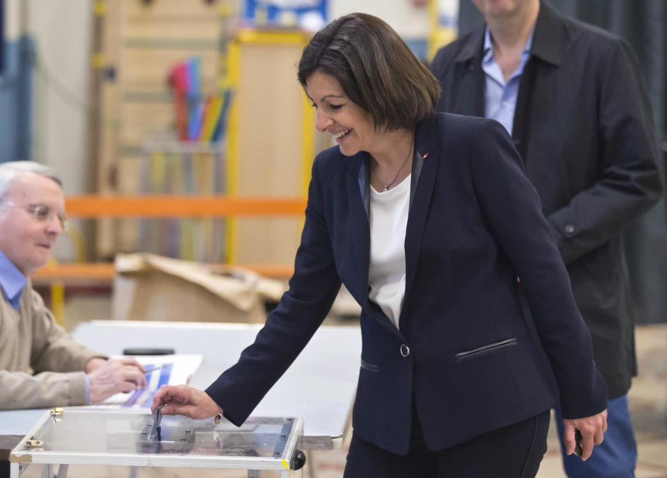 Socialist candidate for the mayor of Paris, Anne Hidalgo casts her ballot during the municipal elections in Paris, Sunday, March 30, 2014. Voters in Paris and across France are going to the polls Sunday in municipal elections seen as a referendum on embattled President Francois Hollande's first two years in office. One bright spot for Hollande is the capital, where Hidalgo is favorite to defeat rival Nathalie Kosciusko-Morizet and keep Paris in Socialist control for another six-year term. (AP Photo/Michel Euler)