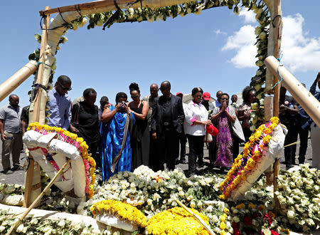 United Nations workers mourn their colleagues during a commemoration ceremony for the victims at the scene of the Ethiopian Airlines Flight ET 302 plane crash, near the town Bishoftu, near Addis Ababa, Ethiopia March 15, 2019. REUTERS/Tiksa Negeri