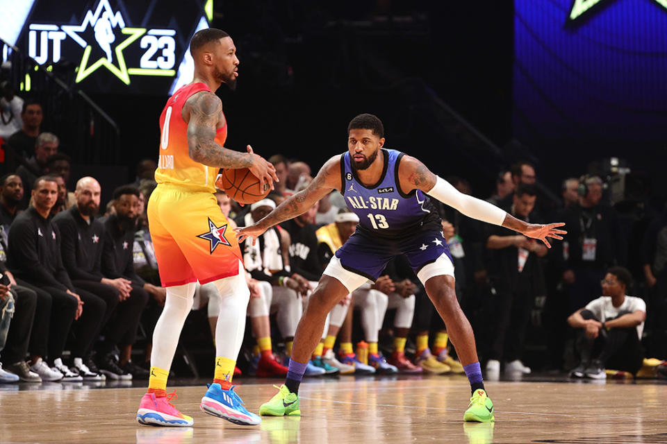 Damian Lillard (L) in the Adidas Dame 8 and Paul George in the Nike Kobe 6 Protro “Grinch” during the 2023 NBA All-Star Game. - Credit: Tim Nwachukwu/Getty Images