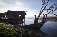 A resident walks in Tanjung Labian, near where Philippine militants have staked a territorial claim on February 21, 2013. The Sultanate of Sulu once controlled parts of Borneo as well as southern Philippine islands