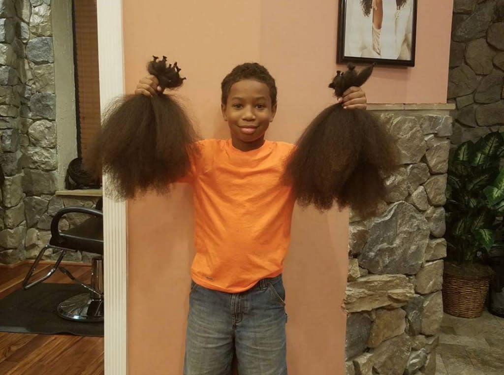 Thomas Moore grew enough hair to make three wigs for kids with cancer. (Photo: Courtesy of Twitter/storkpatrol)