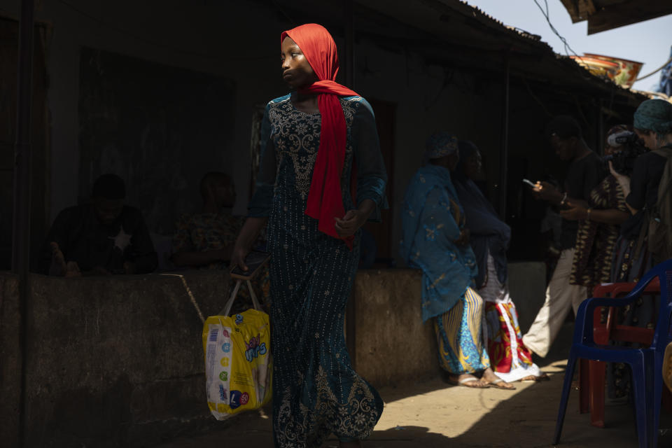 Mourners leave after the funeral of Ousmane Sylla at Matoto Bonagui, a suburb of Conakry, Guinea, Tuesday, April 9, 2024. (AP Photo/Misper Apawu)