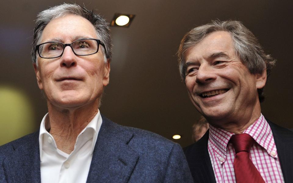 John W Henry stands alongside Sir Martin Broughton - ‘Liverpool and Manchester United not worth £4bn – because they are not in London’ - Shutterstock/Andy Rain