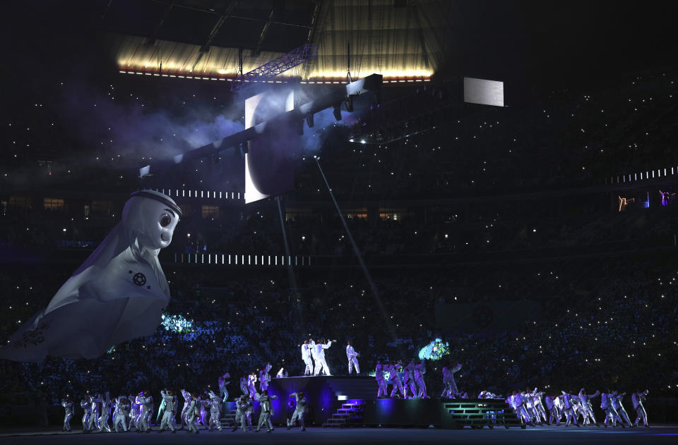 Artists perform during the opening ceremony for the World Cup, prior to the group A soccer match between Qatar and Ecuador at the Al Bayt Stadium in Al Khor, Sunday, Nov. 20, 2022. (AP Photo/Ariel Schalit)