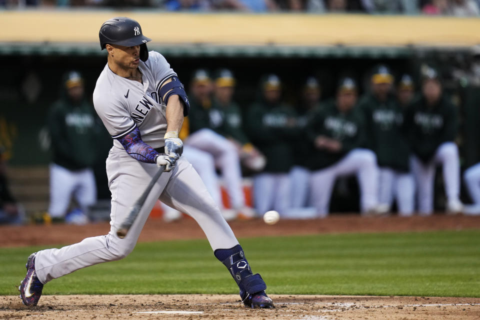 New York Yankees' Giancarlo Stanton hits a two-run single against the Oakland Athletics during the fifth inning of a baseball game in Oakland, Calif., Wednesday, June 28, 2023. (AP Photo/Godofredo A. Vásquez)