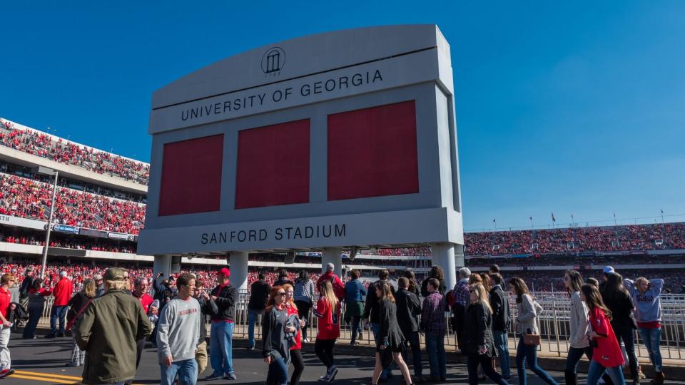 Athens, Georgia, United States: November 26, 2017: Crowd passes under Sanford Stadium Sign on Game Day.