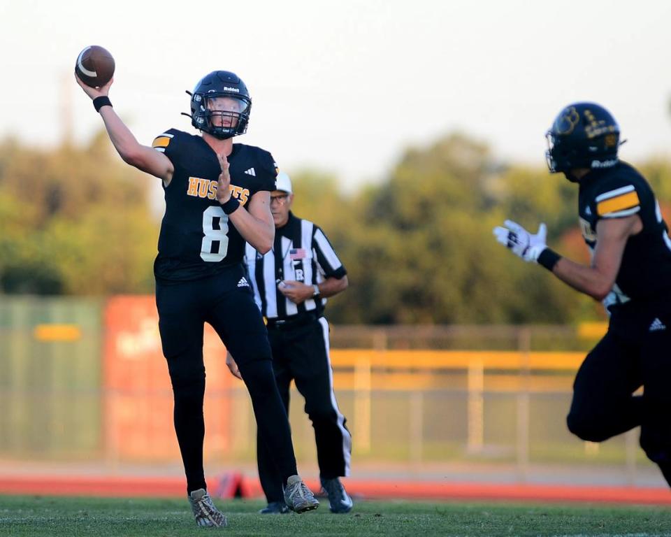 Hughson quarterback Robert McDaniel throws a pass to the flat during a game between Hughson High School and Central Valley High School at Hughson High School in Hughson California on August 25, 2023.