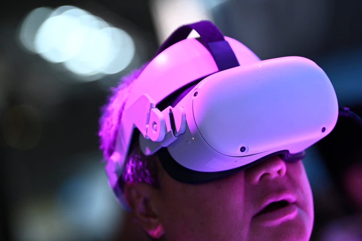 A person tries a Meta Quest virtual reality headset (AFP via Getty Images)