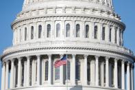 The American Flag flies at the U.S. Capitol Building, as Mayor Muriel Bowser declared a State of Emergency due to the coronavirus disease (COVID-19), on Capitol Hill in Washington