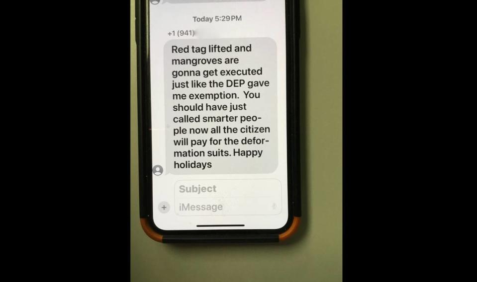 A screenshot shows a message that Anna Maria resident Ronnie Leto said he received from a contractor after reporting the removal of mangroves along the shore of a property where a new home is being constructed. The number has been removed for privacy.