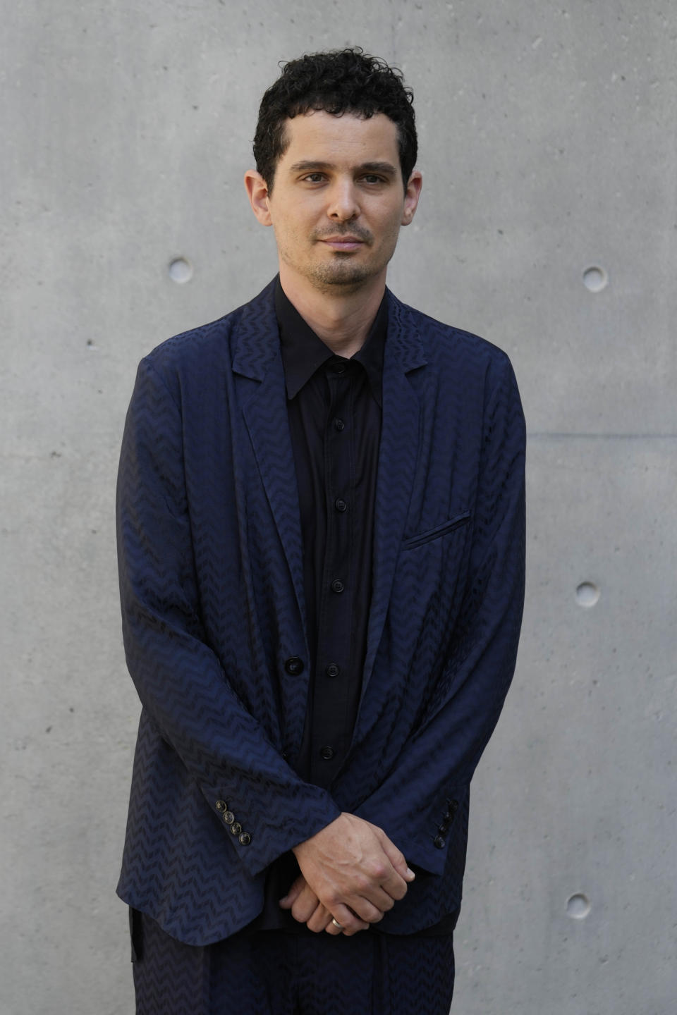 Damien Chazelle attends the Giorgio Armani Men's Spring Summer 2025 fashion show, that was presented in Milan, Italy, Monday, June 17, 2024. (AP Photo/Luca Bruno).