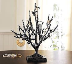 A jewelry tree, like this Butterfly Jewelry Tree ($49) is always a pretty option for displayingâ€¦