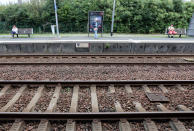 Travelers wait for trains on the platform of the station of Saint Jean de Luz, southwestern France, Friday, Oct.18, 2019. A wildcat strike is disrupting train travel around France, as railway workers demand better security after a recent accident. (AP Photo/Bob Edme)