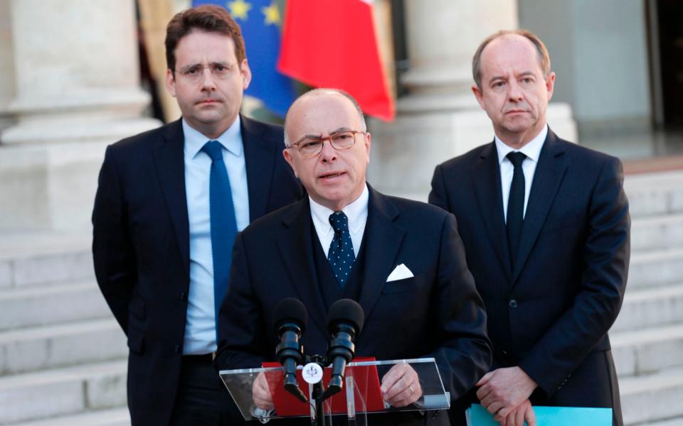 French Prime Minister Bernard Cazeneuve speaks next to Interior Minister Matthias Fekl (L) and Justice Minister Jean-Jacques Urvoas - Credit: THOMAS SAMSON/AFP/Getty Images