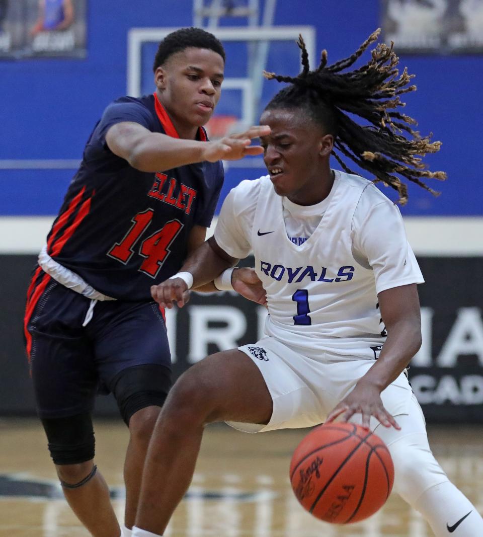 CVCA guard LaVelle Sharpe Jr., right, drives to the basket against Ellet's Aramis Dunn during the first half of a high school basketball game, Friday, Feb. 9, 2024, in Cuyahoga Falls, Ohio.