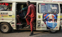 A matatu, or public minibus, displays an informational painting instructing people to wear masks to curb the spread of the coronavirus, in the low-income Kibera neighborhood of Nairobi, Kenya, Saturday, June 12, 2021. Africa has recorded more than 5 million confirmed COVID-19 cases, including 135,000 deaths. That is a small fraction of the world's caseload, but many fear the crisis could get much worse. ​(AP Photo/Brian Inganga)