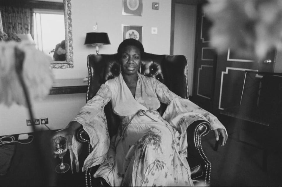Singer, songwriter, pianist, arranger and activist <span class="caas-xray-inline-tooltip"><span class="caas-xray-inline caas-xray-entity caas-xray-pill rapid-nonanchor-lt" data-entity-id="Nina_Simone" data-ylk="cid:Nina_Simone;pos:3;elmt:wiki;sec:pill-inline-entity;elm:pill-inline-text;itc:1;cat:Musician;" tabindex="0" aria-haspopup="dialog"><a href="https://search.yahoo.com/search?p=Nina%20Simone" data-i13n="cid:Nina_Simone;pos:3;elmt:wiki;sec:pill-inline-entity;elm:pill-inline-text;itc:1;cat:Musician;" tabindex="-1" data-ylk="slk:Nina Simone;cid:Nina_Simone;pos:3;elmt:wiki;sec:pill-inline-entity;elm:pill-inline-text;itc:1;cat:Musician;" class="link ">Nina Simone</a></span></span> relaxes on Sept. 14, 1979 in the United Kingdom. (Photo: Mike Lawn/Evening Standard/Hulton Archive/Getty Images)