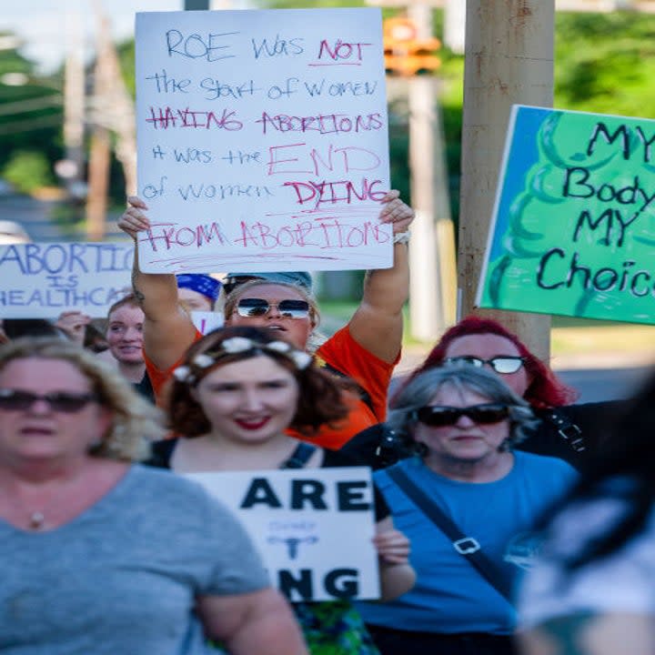 people peacefully marching with signs