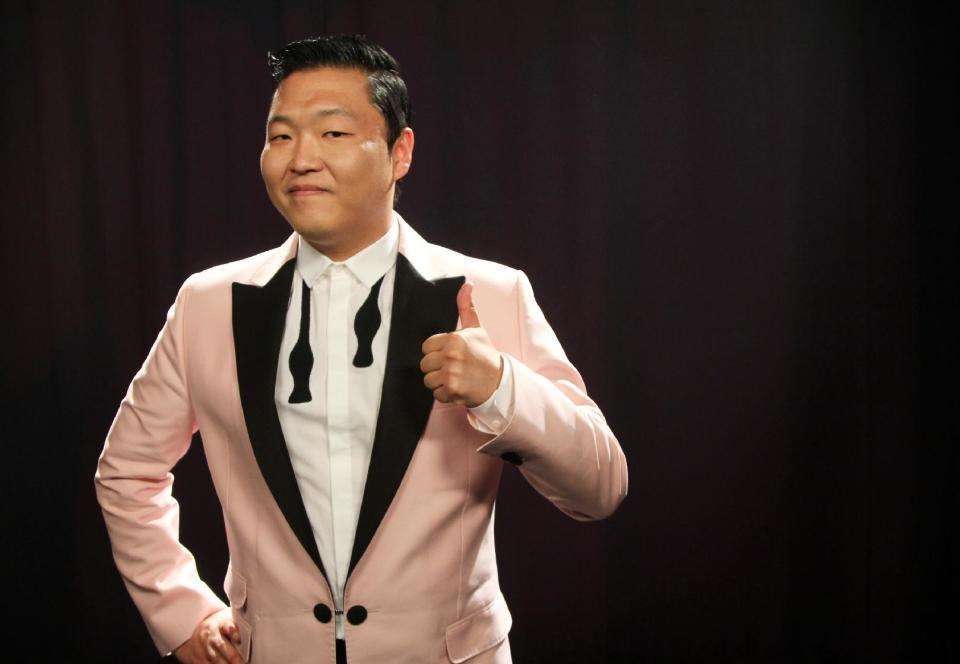 This Aug. 22, 2012 photo shows South Korean rapper PSY, born Jae-Sang Park, posing for a photo in New York. The music video for “Gangnam Style,” released last month, so far has garnered more than 49 million views on YouTube. The bright, vibrant clip features the comedic and flamboyant PSY delivering somewhat bizarre choreography while rapping and singing in Korean over a thumping, dance-flavored beat. It’s currently No. 1 on iTunes’ music videos chart. (AP Photo/John Carucci)