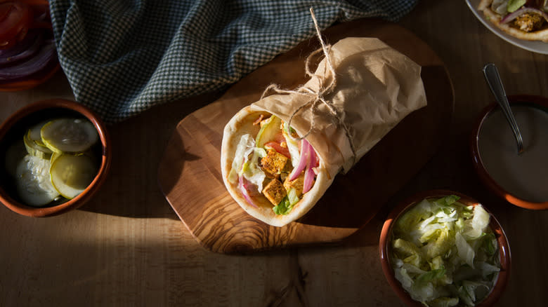 wrapped tofu shawarma on table