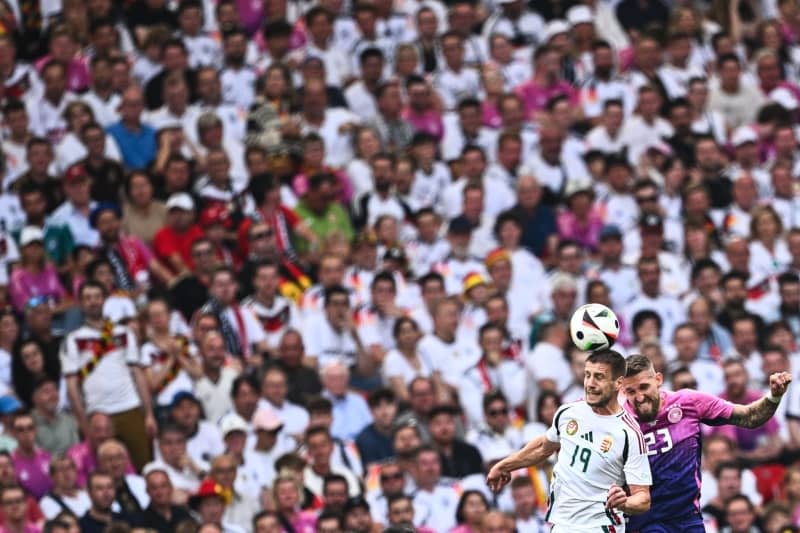 Hungary's Barnabas Varga (L) and Germany's Robert Andrich battle for the ball during the UEFA Euro 2024 group A soccer match between Germany and Hungary at Stuttgart Arena. Tom Weller/dpa