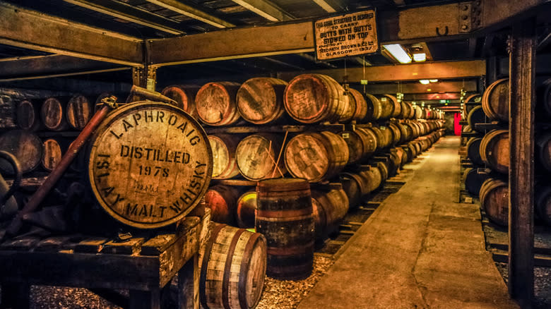 rows of aging whisky barrels