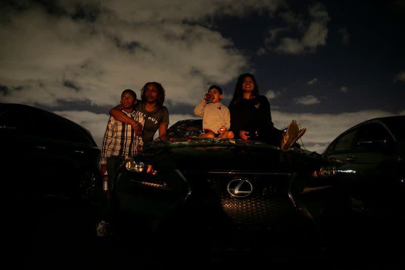 People enjoy movies at a drive-in theatre while keeping social distancing following the outbreak of the coronavirus disease in Fort Lauderdale