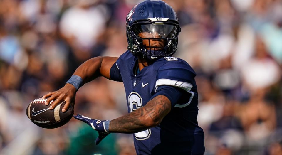 UConn Huskies quarterback Ta'Quan Roberson (6) throws a pass against the FIU Golden Panthers at Rentschler Field at Pratt & Whitney Stadium.