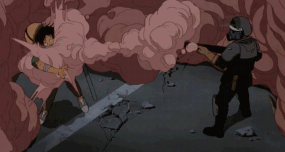 A protester gets hit with a smoke canister in Akira. (Toei Animation) 