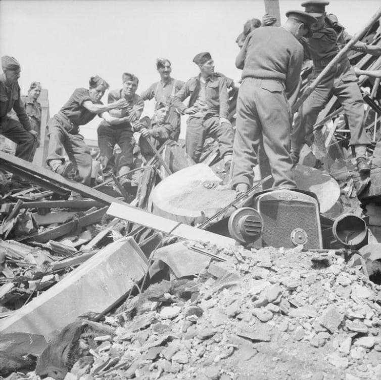 <span class="caption">Clearing the rubble.</span> <span class="attribution"><a class="link " href="https://commons.wikimedia.org/wiki/File:The_British_Army_in_the_United_Kingdom_1939-45_H11954.jpg" rel="nofollow noopener" target="_blank" data-ylk="slk:© Imperial War Museum/Wikimedia Commons;elm:context_link;itc:0;sec:content-canvas">© Imperial War Museum/Wikimedia Commons</a></span>