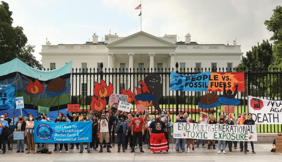 Demonstrators rallied outside the White House in October 2021 as part of the ‘Climate Chaos Is Happening Now’ protest. Organized by the Indigenous Environmental Network, the Sunrise Movement and other groups, activists were demanding that President Joe Biden stop approving fossil fuel projects and declare a climate emergency. (Photo by Chip Somodevilla/Getty Images)