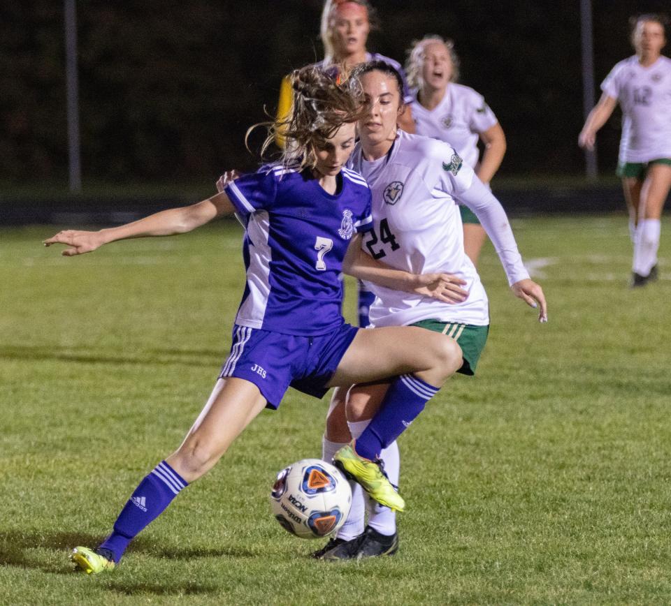 Jackson’s Aila Graham moves in front of GlenOak’s Emma Pooley on Monday, Oct. 23, 2023.