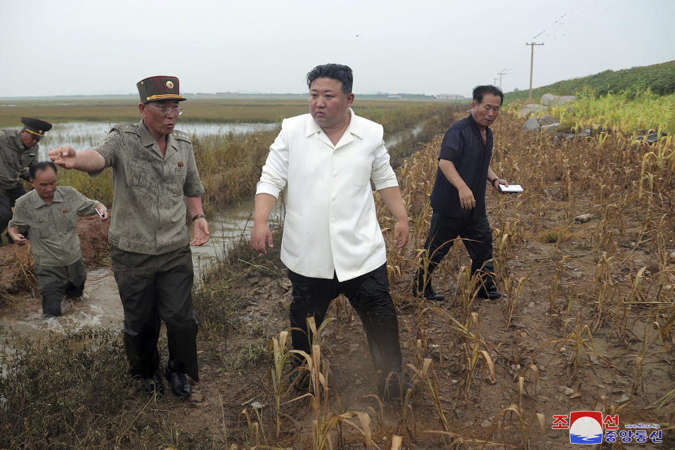 In this photo provided by the North Korean government, North Korean leader Kim Jong Un, center, visits a tideland under restoration in Nampho, North Korea Monday, Aug. 21, 2023. Independent journalists were not given access to cover the event depicted in this image distributed by the North Korean government. The content of this image is as provided and cannot be independently verified. Korean language watermark on image as provided by source reads: "KCNA" which is the abbreviation for Korean Central News Agency. (Korean Central News Agency/Korea News Service via AP)