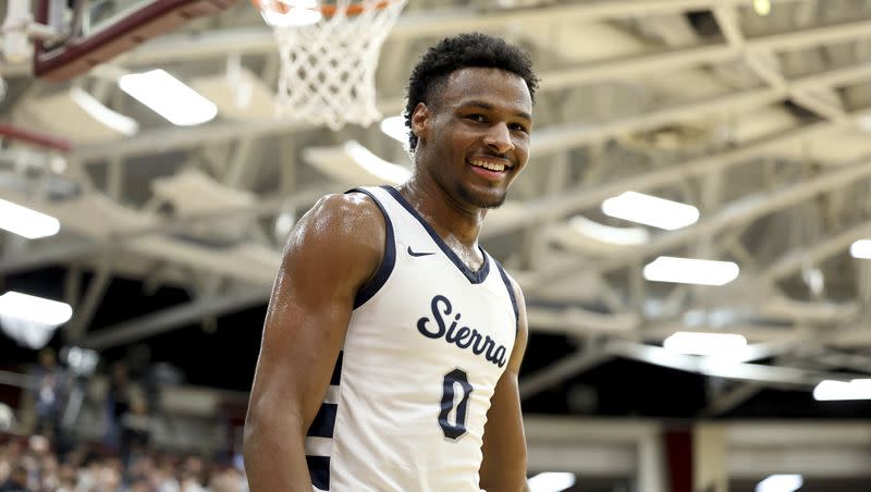 FILE - Sierra Canyon’s Bronny James (0) smiles during a high school basketball game against Christopher Columbus at the Hoophall Classic, Monday, Jan. 16, 2023, in Springfield, Mass. Bronny James, son of NBA superstar LeBron James, was hospitalized after going into cardiac arrest while participating in a practice at Southern California on Monday, July 24, 2023.