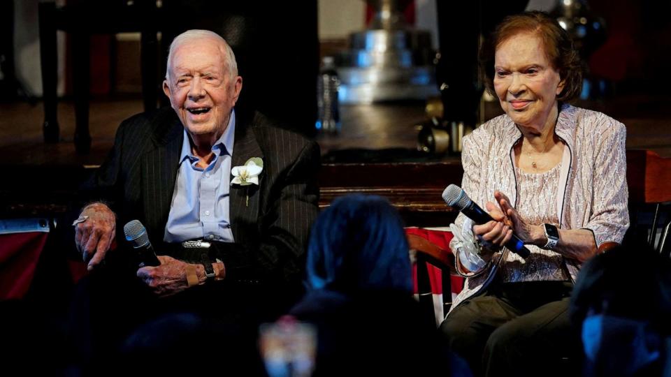 PHOTO: Former U.S. President Jimmy Carter and his wife, former first lady Rosalynn Carter sit together during a reception to celebrate their 75th wedding anniversary in Plains, Ga., July 10, 2021. (John Bazemore/Pool via Reuters, FILE)