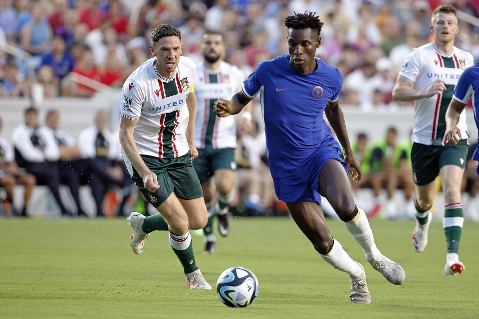 Chelsea's Nicolas Jackson moves the ball past Wrexham's Ben Tozer during the first half of a club friendly soccer match Wednesday, July 19, 2023, in Chapel Hill, N.C. (AP Photo/Karl B DeBlaker)