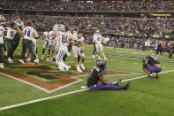Kansas State players celebrate as TCU's Tre'Vius Hodges-Tomlinson (1) sits in the end zone with Dee Winters (13) after Kansas State defeated TCU in overtime of the Big 12 Conference championship NCAA college football game, Saturday, Dec. 3, 2022, in Arlington, Texas. (AP Photo/LM Otero)