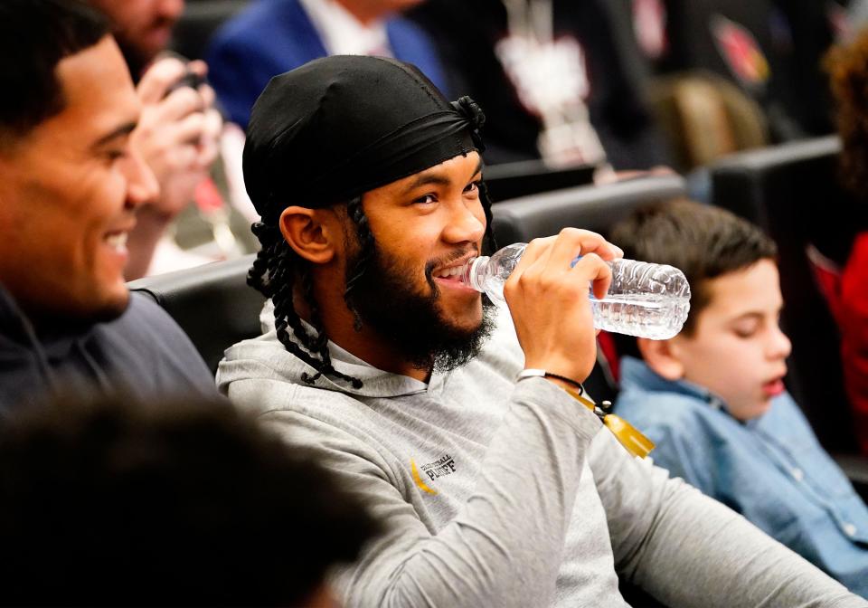 Quarterback Kyler Murray sits in the front row as Jonathan Gannon is introduced as the new head coach of the Arizona Cardinals during a news conference at the Cardinals training facility in Tempe on Feb. 16, 2023.