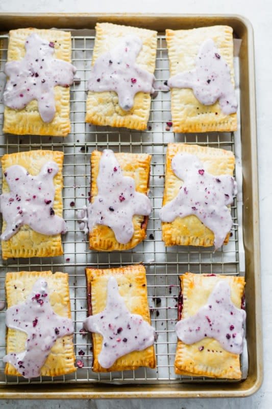 <p>Blue Bowl Recipes</p><p>These pop tarts are filled with a smooth blueberry jam, wrapped in a perfectly crisp, flaky pie crust, and topped with a drizzle of blueberry icing. They’re better than the store-bought ones!</p><p><strong>Get the recipe: <a href="https://bluebowlrecipes.com/homemade-blueberry-pop-tarts/" rel="nofollow noopener" target="_blank" data-ylk="slk:Blueberry Pop Tarts;elm:context_link;itc:0;sec:content-canvas" class="link "><em>Blueberry Pop Tarts</em></a></strong></p>