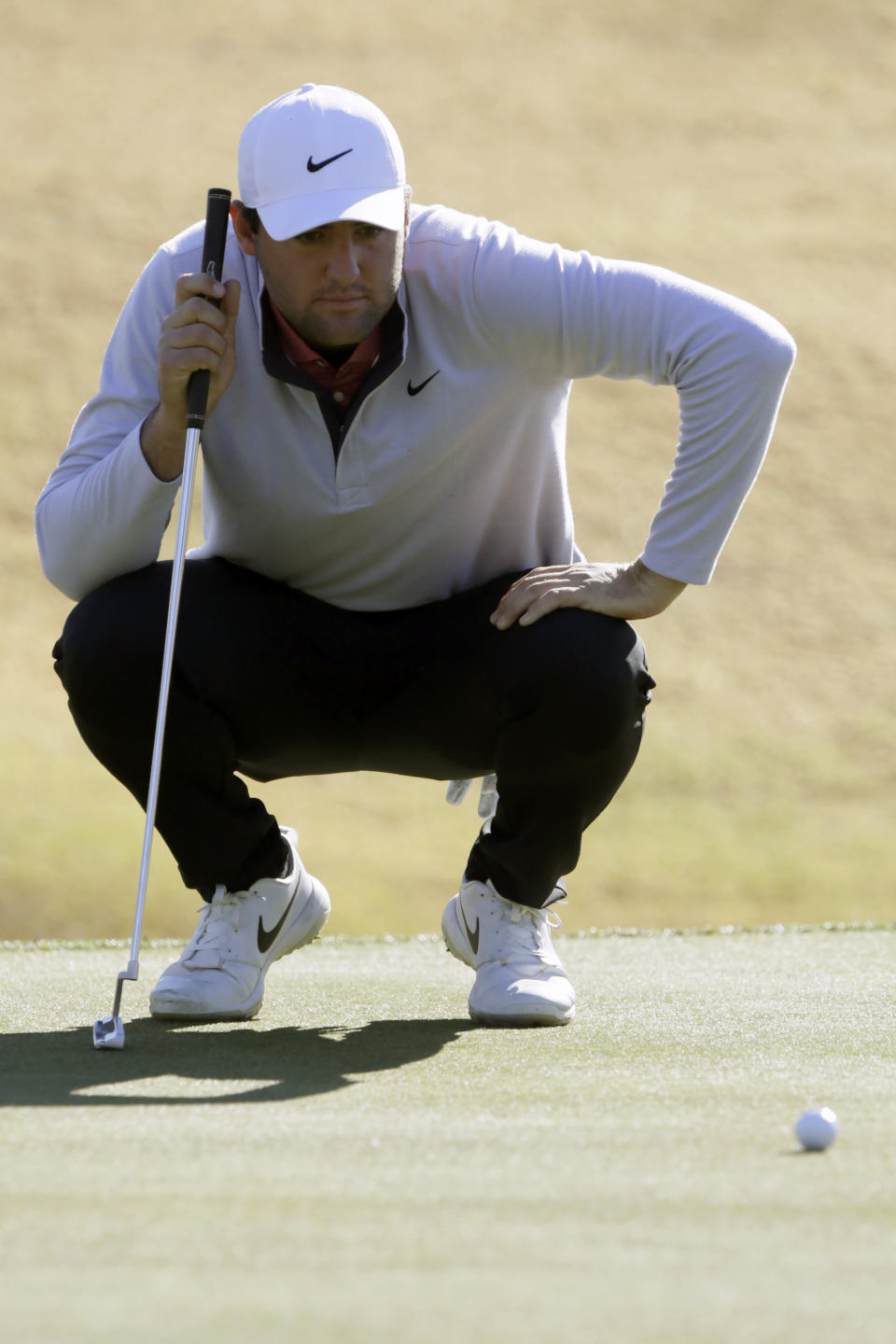 Scott Scheffler reads the green on the second hole during the third round of The American Express golf tournament on the Stadium Course at PGA West in La Quinta, Calif., Saturday, Jan. 18, 2020. (AP Photo/Alex Gallardo)