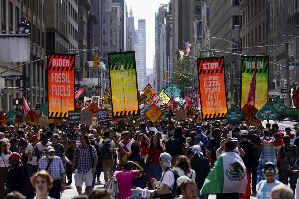 Climate activists march on Madison Avenue while protesting energy policy and the use of fossil fuels, in New York, Sunday, Sept. 17, 2023. (AP Photo/Bryan Woolston)