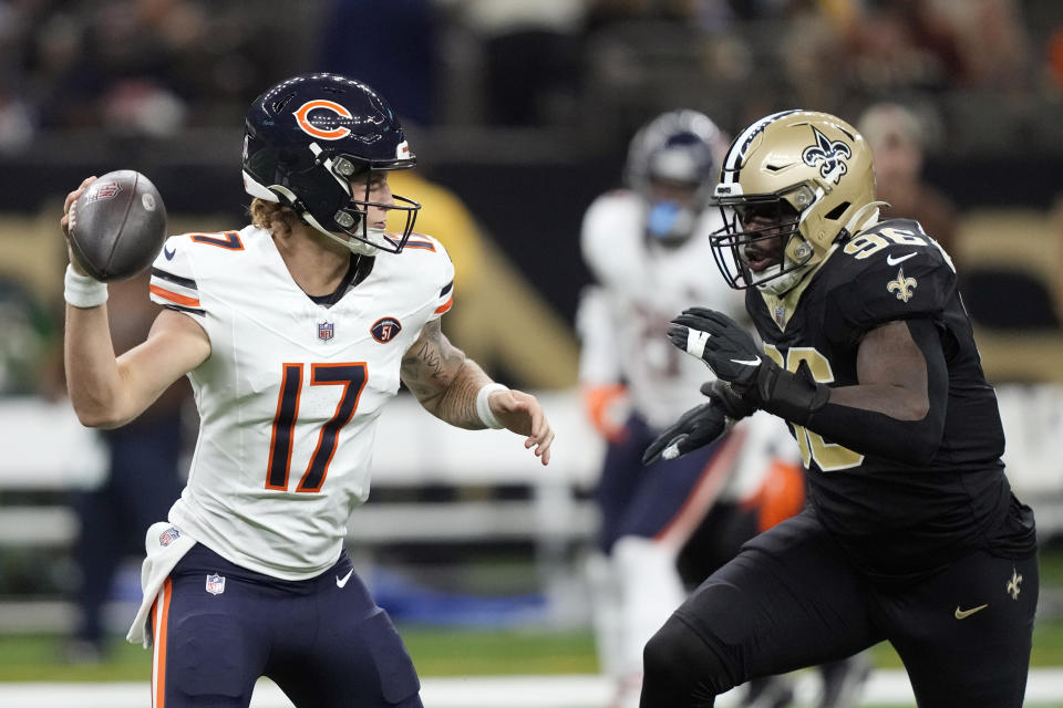 Chicago Bears quarterback Tyson Bagent (17) prepares to throw as New Orleans Saints defensive end Carl Granderson (96) closes in during the first half of an NFL football game in New Orleans, Sunday, Nov. 5, 2023. (AP Photo/Gerald Herbert)